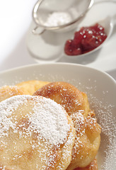 Image showing Polish doughnuts poured with icing sugar