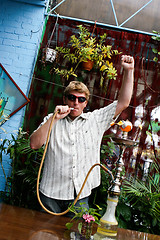 Image showing Man smoking a hookah.