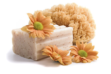 Image showing natural sponge, soap and flowers