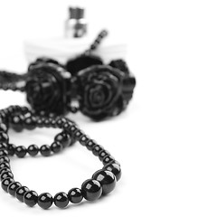 Image showing black necklace, bracelet and parfume
