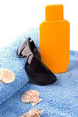 Image showing towel, sunglasses and lotion