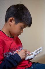 Image showing Boy playing video game