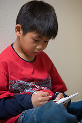 Image showing Boy playing video game