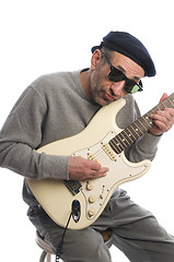 Image showing senior man playing guitar