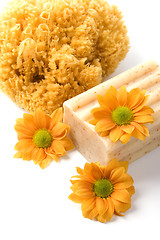 Image showing natural sponge, soap and flowers