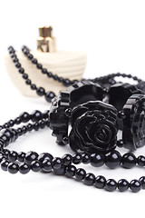 Image showing black necklace, bracelet and parfume 