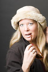 Image showing cute forty year old woman vintage sunglasses and hat