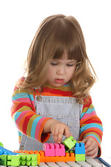 Image showing girl playing colorful building toy blocks 