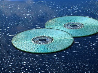 Image showing CD and water drops over blue background