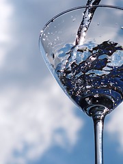 Image showing Glass of pouring water with reflection