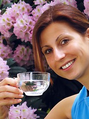 Image showing Young girl drinking water