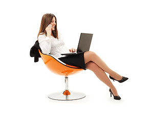 Image showing businesswoman in chair with laptop and phone