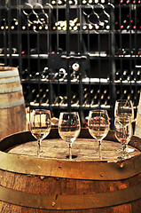 Image showing Wine  glasses and barrels
