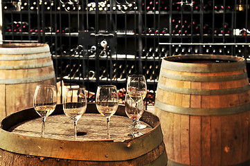 Image showing Wine  glasses and barrels