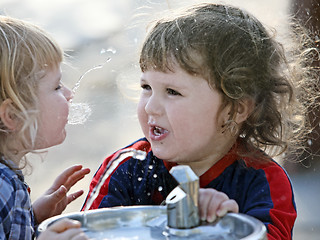 Image showing Two boys by the drinking fountain