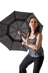 Image showing Mad woman with umbrella