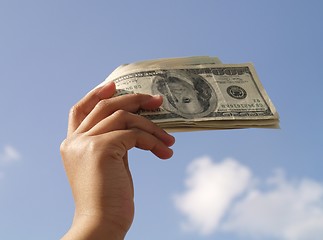 Image showing holding dollar bills