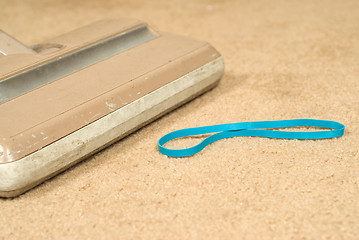 Image showing Vacuuming The Carpet