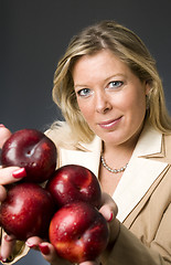 Image showing attractive blond woman with plums fruit for healthy life