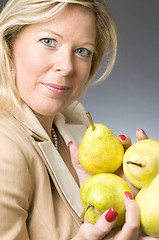 Image showing attractive blond woman with pears fruit for healthy life