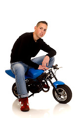 Image showing Youngster with his pocketbike