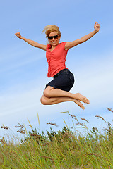 Image showing Young lady jumping