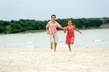 Image showing kids running on the beach