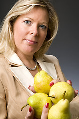 Image showing attractive blond woman with pears fruit for healthy life