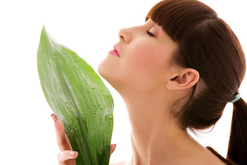 Image showing woman with green leaf