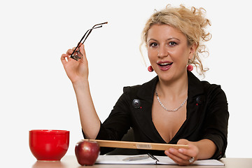 Image showing Woman sitting at desk