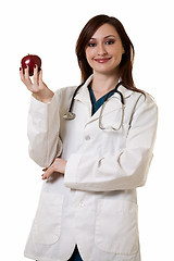 Image showing Lady doctor with apple