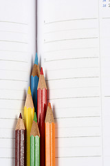 Image showing Color pencil and agenda