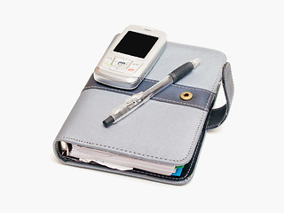 Image showing Business tools - Pen diary and a cell phone