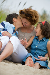 Image showing Mother and kids on the beach