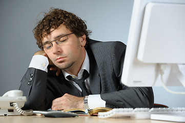 Image showing overworked businessman
