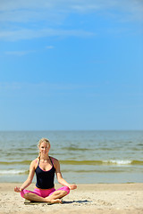 Image showing beautiful female workout on the beach