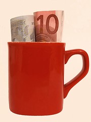 Image showing money in mug