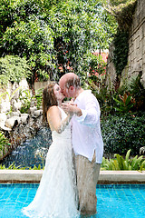 Image showing Bride and groom kissing.