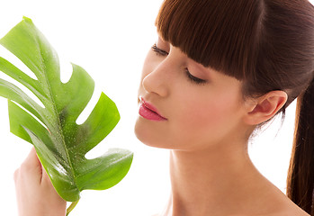 Image showing woman with green leaf