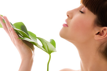 Image showing woman with green leaf