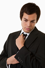 Image showing Man fixing tie