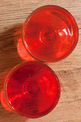 Image showing Two glasses with jelly, oak floor