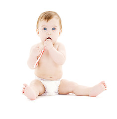 Image showing baby boy in diaper with toothbrush