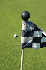 Image showing Golf Course Flag And A Golf Ball