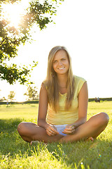 Image showing sitting on grass