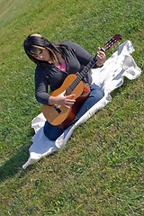 Image showing Woman Playing Her Guitar