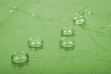 Image showing Water drops on green background
