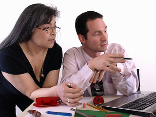 Image showing Business Couple at Desk