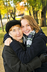 Image showing Granddaughter hugging grandmother