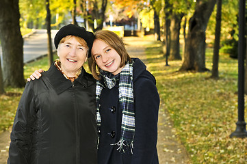 Image showing Granddaughter walking with grandmother